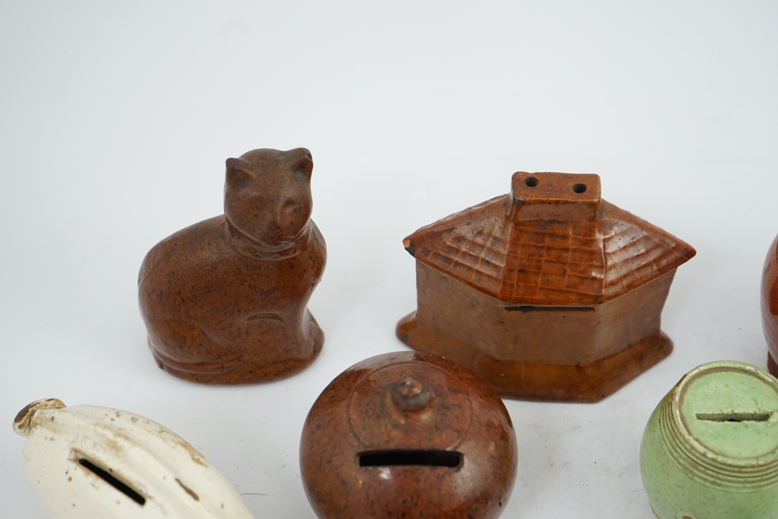 A collection of ten 19th century Dutch and British pottery money boxes